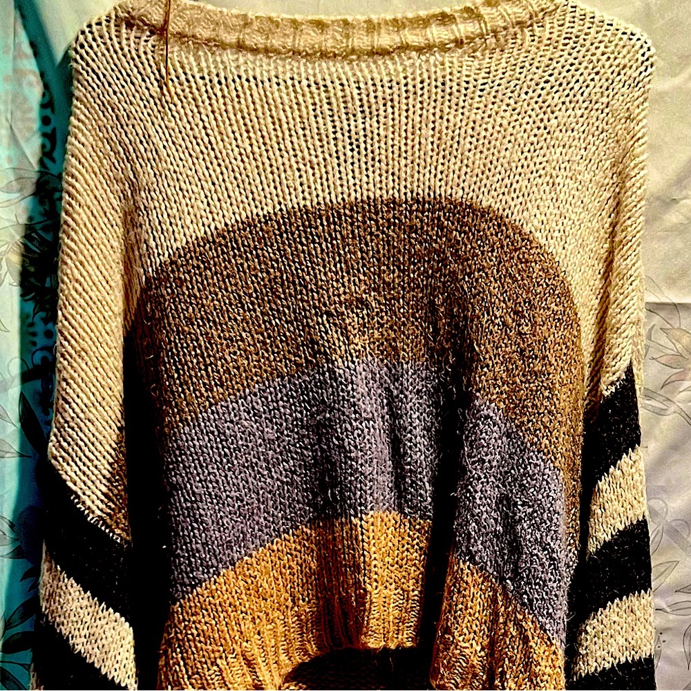 Oversized long sleeve, patterned sweater, multicolored with striped sleeve.